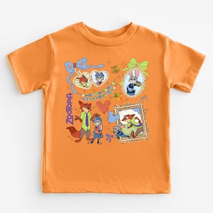 The image is a t-shirt with a vibrant, cartoon-style design featuring various cartoon characters and elements, such as a fox, a rabbit, and a bird.