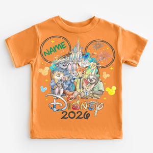 An orange t-shirt with a Disney-themed design featuring various characters from the Disney film series.