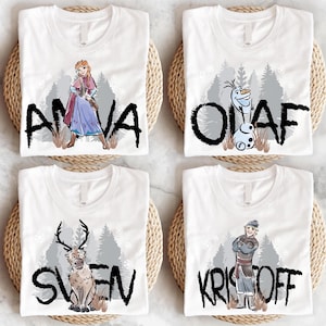 four frozen princess tshirts are on a table