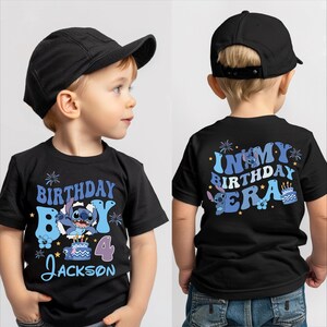 A young boy wearing a black t-shirt with a birthday message and a character from the movie Lilo and Stitch.