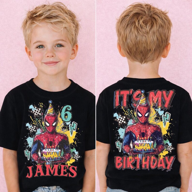 A young boy wearing a black t-shirt with a Spider-Man design and the text "It's my birthday" printed on the back.