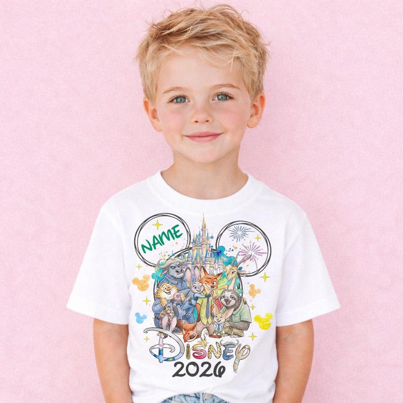 A young boy wearing a white t-shirt with a Disney-themed graphic and text, including the Disney logo and the text "Disney 2020".