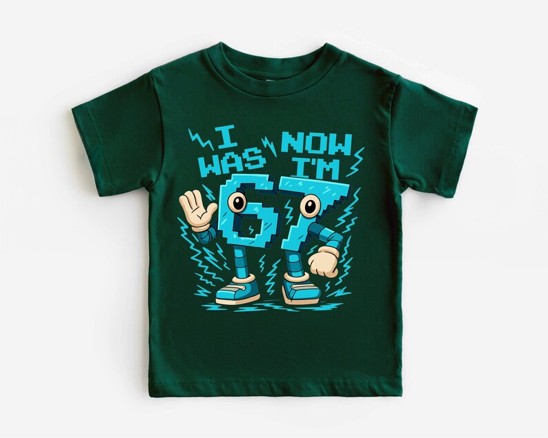 A green t-shirt with a graphic design featuring a robot character and text that says "I WAS NOW IM".