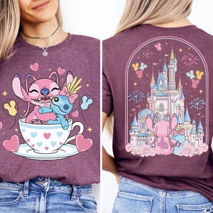 The image is a collage of two images featuring a woman wearing a purple t-shirt with a cartoon design of a cup with a small blue animal inside, and a castle in the background.