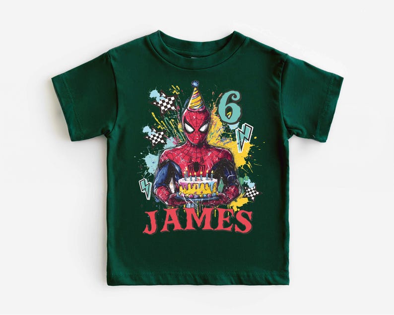 A green t-shirt with a Spider-Man graphic and the number 6, along with the text "JAMES" printed on it.