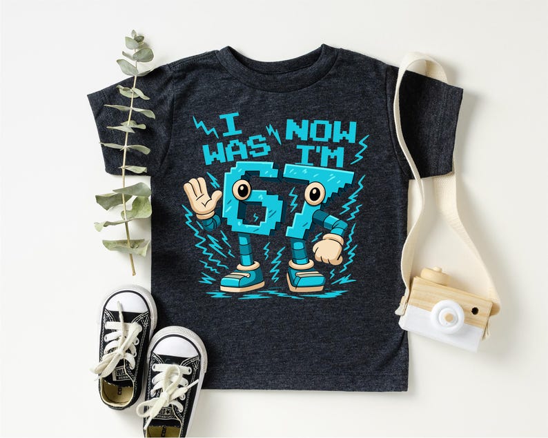 a black t-shirt with a graphic design, a pair of black and white sneakers, and a white camera.