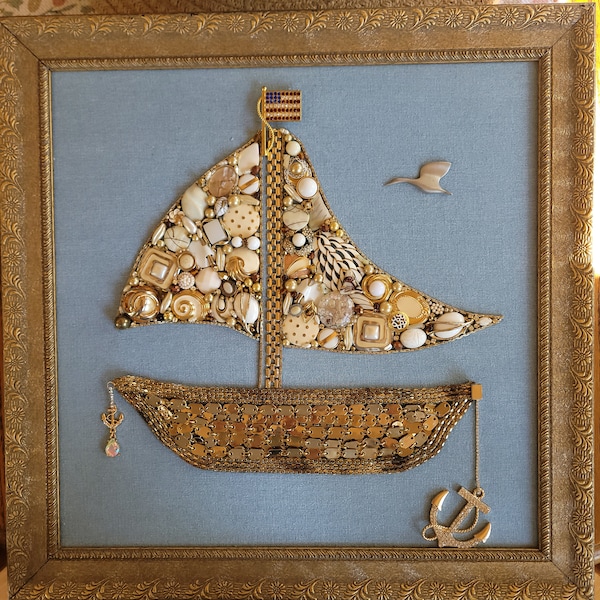 Framed jewelry art, Sailboat, created with vintage and costume jewelry in a  gold vintage frame.  17.5"x17.5" coastal style home decor.