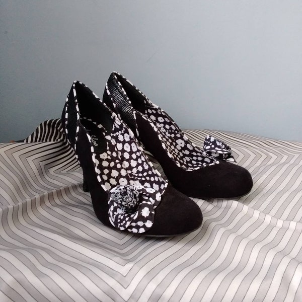 Vintage style Ruby Shoo heeled shoes in Black. Ruby Shoo shoes in black faux suede with black and white material embellishments.