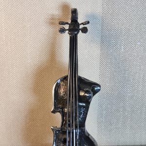 Metal sculpture of a guitar