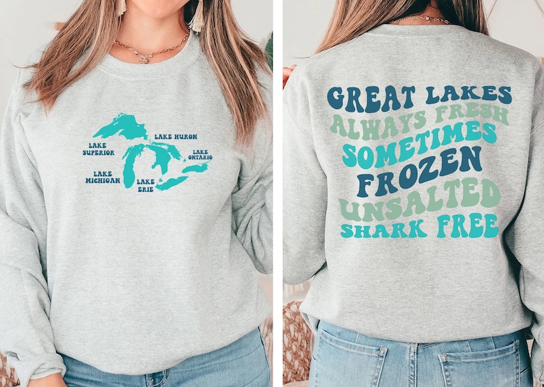 May include: Gray sweatshirt with a blue outline of the Great Lakes and the names of each lake on the front. The back of the sweatshirt has the text "Great Lakes Always Fresh Sometimes Frozen Unsalted Shark Free" in a rainbow of colors.