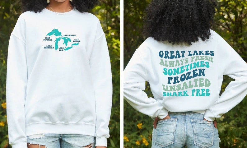 May include: White sweatshirt with a graphic of the Great Lakes on the front and the text "Great Lakes Always Fresh Sometimes Frozen Unsalted Shark Free" on the back.