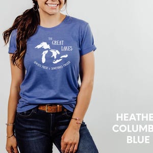 May include: A blue t-shirt with a white graphic of the Great Lakes and the text "The Great Lakes Always Fresh & Sometimes Frozen".