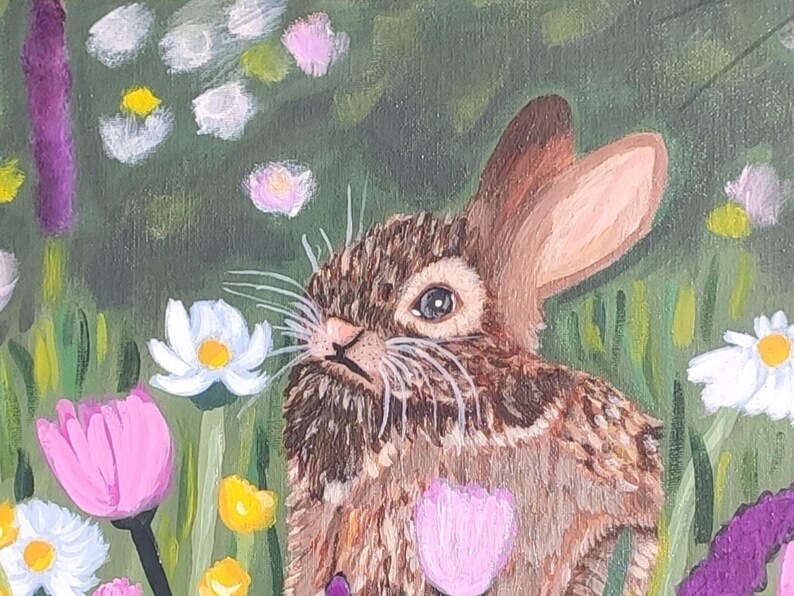 May include: An acrylic painting of a brown rabbit with textured fur, long ears, and white whiskers, positioned in a vibrant meadow filled with white daisies, pink tulips, and purple wildflowers against a deep green background.
