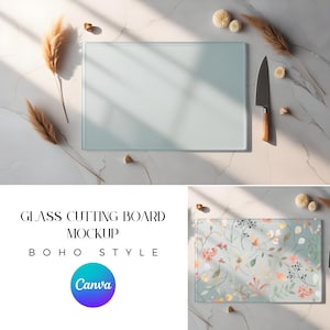 May include: Two glass cutting boards on a white marble surface. One board is clear and the other has a floral pattern in shades of pink, yellow, and green. A knife is next to the clear board.