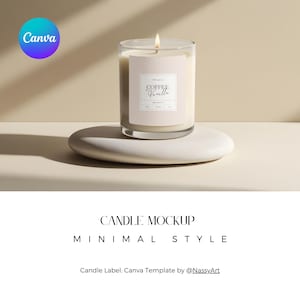 May include: A white candle with a clear glass jar and a label that reads "Coffee Vanilla". The candle is sitting on a white stone and a light beige surface.