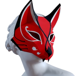 Peut inclure: Un masque de renard rouge et noir avec des marques blanches. Le masque est en papier et a un nez pointu et ac&eacute;r&eacute;.