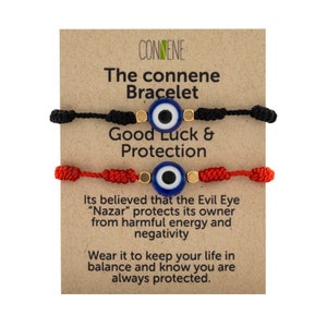 May include: Two evil eye bracelets, one red and one black, with gold beads and blue evil eye charms. The card reads "The connene Bracelet Good Luck & Protection Its believed that the Evil Eye "Nazar" protects its owner from harmful energy and negativity Wear it to keep your life in balance and know you are always protected."