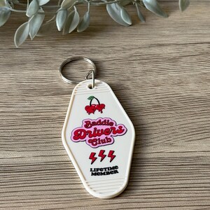 baddie drivers club motel keychain