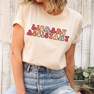 Library assistant shirt, book club shirt, back to school shirt, book lover shirt, librarian shirts, school librarian, librarian gifts tee