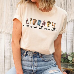 Library assistant shirt, book club shirt, back to school shirt, book lover shirt, librarian shirts, school librarian, librarian gifts tee