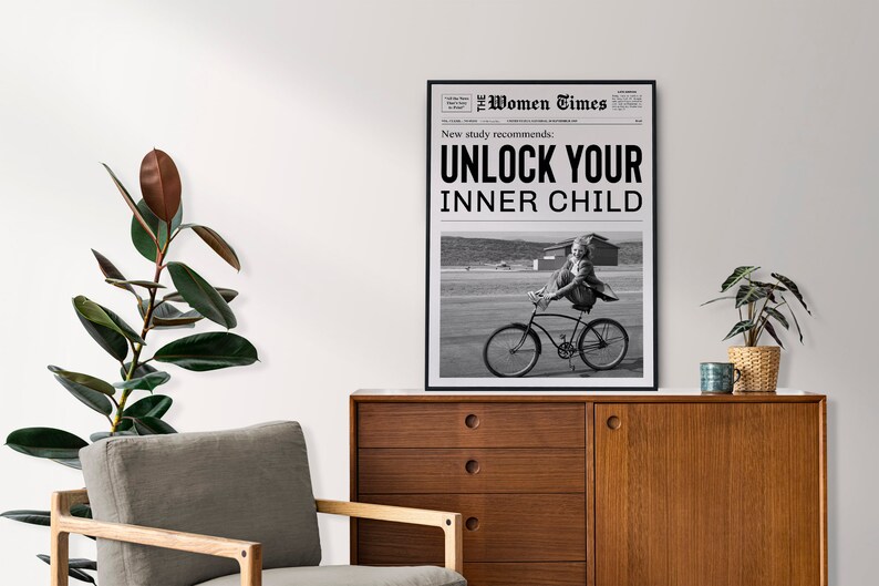 May include: Black and white newspaper print with the headline "Unlock Your Inner Child" and a photo of a girl riding a bicycle.