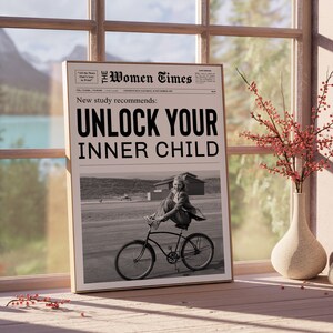 May include: A black and white newspaper clipping with the headline "Unlock Your Inner Child." The clipping features a photo of a young girl riding a bicycle.