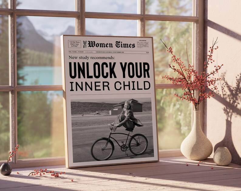 May include: A black and white newspaper clipping with the headline "Unlock Your Inner Child." The clipping features a photo of a young girl riding a bicycle.