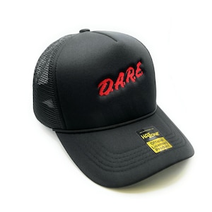 May include: Black trucker hat with a red embroidered "DARE" logo. The hat has a mesh back and a yellow "Official Licensed Product" tag.