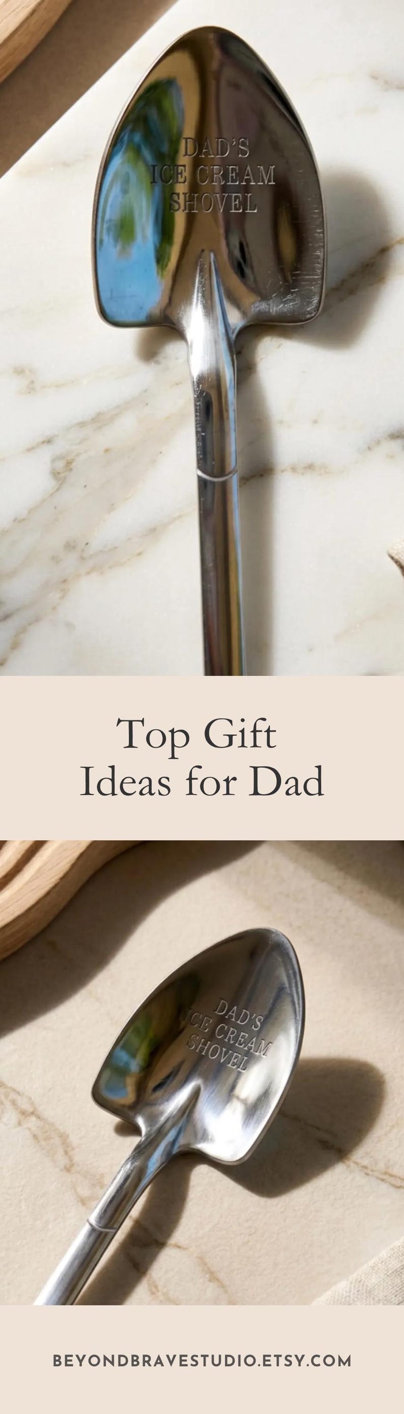 May include: A polished stainless steel spoon shaped like a miniature shovel with the text DAD'S ICE CREAM SHOVEL engraved on the bowl. The spoon features a pointed tip and a smooth, rounded handle, reflecting light on its metallic surface.