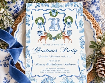 May include: A white rectangular invitation card featuring a blue decorative border, a central letter R, two deer, and two topiary wreaths. The text reads: Please join us for a Christmas Party, Saturday, December 16th, 2023, hosting by Brittany & Washington Roberson, The Roberson Residence, 15432 Main Street, Miami FL 54321, RSVP to 123-456-7890 by October 20th.