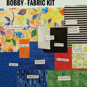 May include: A fabric kit for a sewing project called "Bobby". The kit includes various fabrics in different colors and patterns, including a yellow and blue floral print, a black and white striped fabric, a red and orange floral print, a blue fabric with white polka dots, a green fabric with white squares, and a blue fabric with a wavy pattern. The kit also includes a white fabric with a black eye and a black fabric with the word "Boots" written on it.