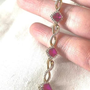Infinity link simulated Ruby Bracelet stamped .925 sun