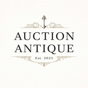 May include: Logo for "Auction Antique" in black text with decorative flourishes and a key icon. The text "Auction Antique" is centered, with "Est. 2021" below. The design is on a cream-colored background.