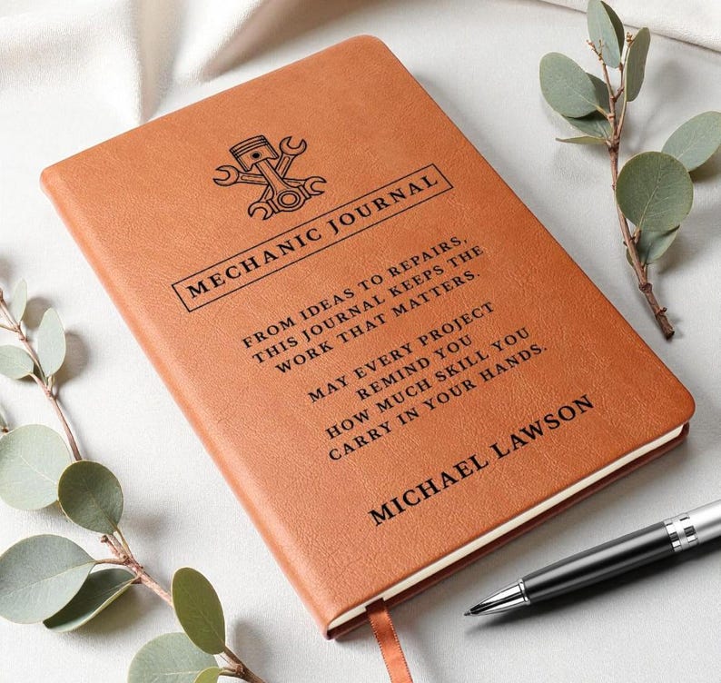 Brown leather mechanic journal, a personalized car guy gift with embossed emblem and MECHANIC JOURNAL title, custom text.