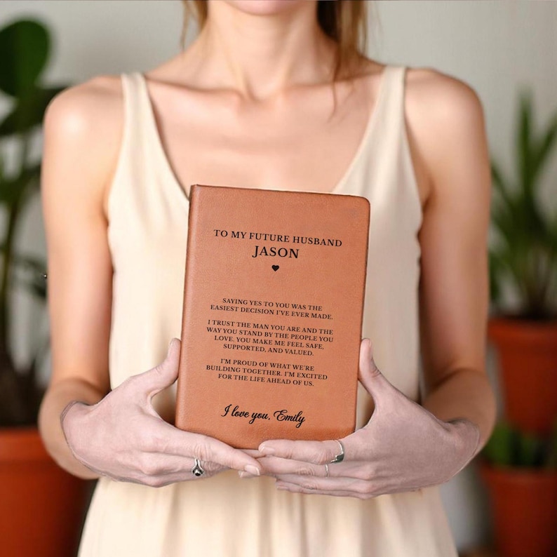 May include: A brown leather-bound journal with the text "TO MY FUTURE HUSBAND" and "JASON" engraved on the cover. The journal contains a heartfelt message and is a personalized gift.