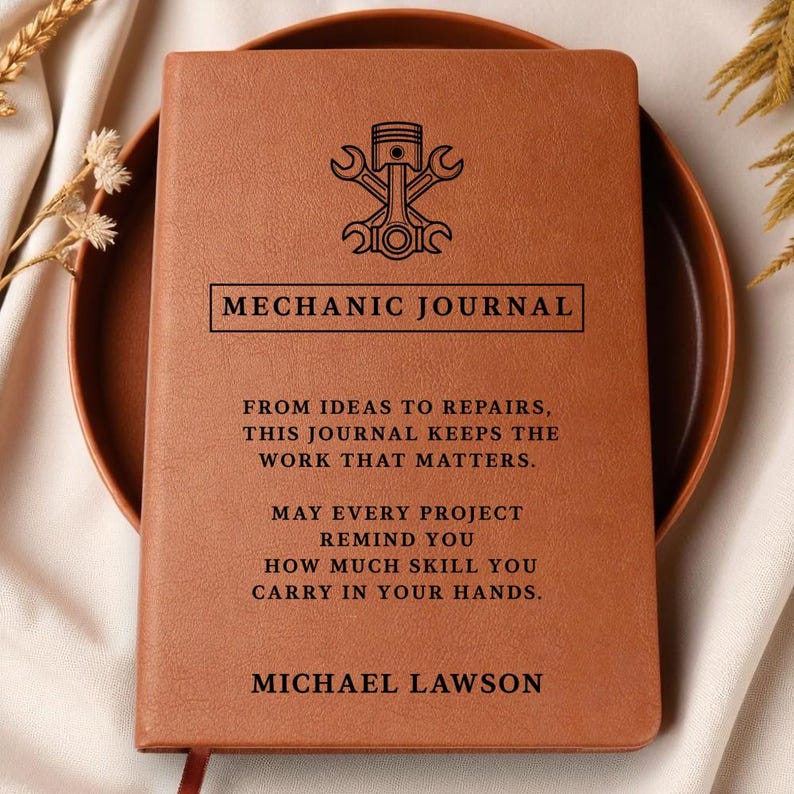 Brown leather mechanic journal, a personalized car guy gift with embossed emblem and MECHANIC JOURNAL title, custom text.