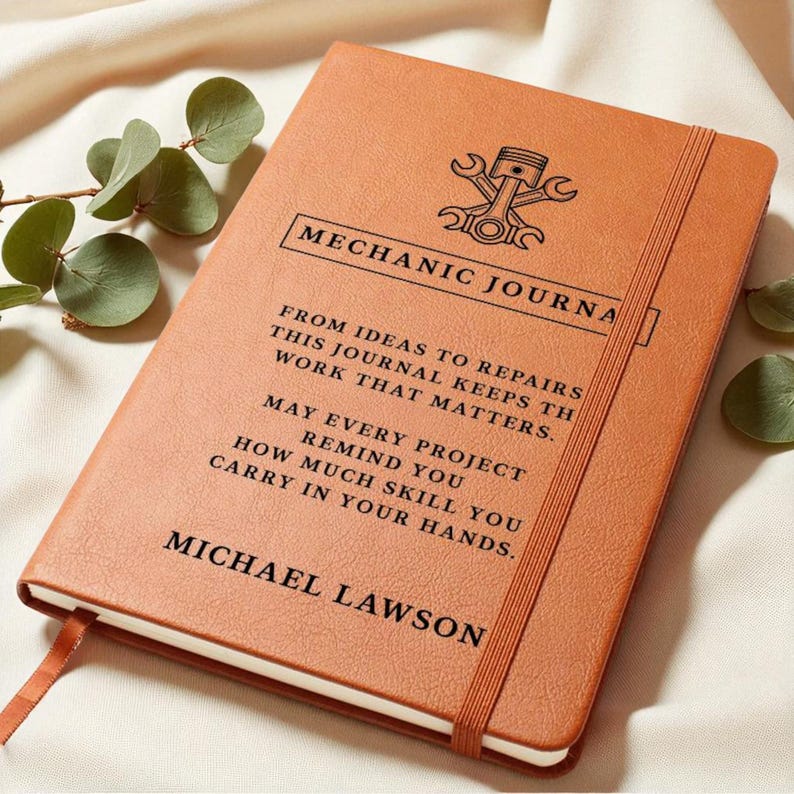 Brown leather mechanic journal, a personalized car guy gift with embossed emblem and MECHANIC JOURNAL title, custom text.