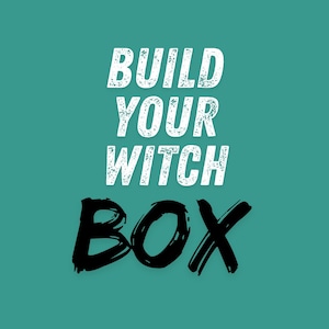 May include: A teal background featuring the white, distressed-style text "BUILD YOUR WITCH" stacked above the word "BOX" written in a bold, black, hand-lettered brush script font. The overall design is centered and uses high-contrast typography.