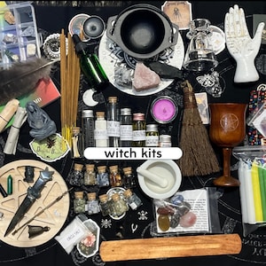 May include: A collection of ritual supplies including a black cauldron, a wooden chalice with a pentacle, a white ceramic mortar and pestle, incense sticks, a small broom, glass vials with labels, crystals, a white hand figurine, and candles.