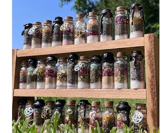 Spell jars with wax tops or witchy charms
