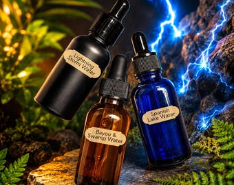 May include: Three glass dropper bottles with black caps and tan labels. One matte black bottle labeled Lightning Storm Water, one amber bottle labeled Bayou & Swamp Water, and one cobalt blue bottle labeled Spanish Lake Water.