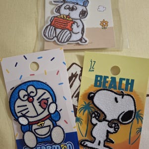 Astronaut Climb Hug Real Design Snoopy & Woodstock Doraemon Dekoration Stoffbeutel Siegel gestickter Aufnäher