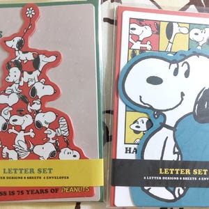Juego de cartas vintage de Snoopy con la frase "La felicidad es de 75 años"