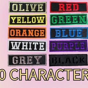 May include: Ten fabric patches with different colors and text. The colors are olive, yellow, orange, white, grey, red, green, blue, purple, and black. The text on the patches reads "OLIVE", "YELLOW", "ORANGE", "WHITE", "GREY", "RED", "GREEN", "BLUE", "PURPLE", and "BLACK". Below the patches is the text "10 CHARACTERS". To the right of the patches is a column of text that reads "FAST", "DISPATCH", "FREE", "POSTAGE", "ROBUST", "MATERIAL", "LOS ANGELES", and "FONT".