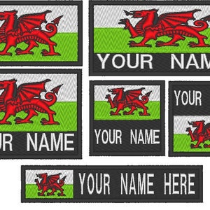 May include: Embroidered patches displaying the Welsh flag, featuring a red dragon on a white and green backdrop. The patches include the text "YOUR NAME" or "YOUR NAME HERE" in white lettering on a black base. Several sizes are presented.