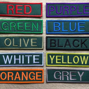 May include: A set of 10 color swatches with the names of each color printed on them. The colors are red, purple, green, blue, olive, black, white, yellow, orange, and grey.