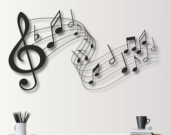 May include: Black and white wall decal featuring a treble clef and musical notes on a staff. The decal is a modern and stylish way to add a touch of music to any room.
