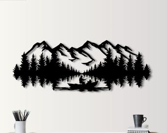 May include: Black metal wall art depicting a mountain range with a lake and a silhouette of a person fishing in a boat.