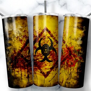 May include: Three yellow and black stainless steel tumblers with a biohazard symbol and red splatters. The tumblers are on a white marble background.