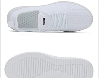 May include: White athletic shoes with a mesh upper and a white rubber sole. The shoes have a black logo that says "WXQ".